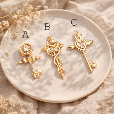 4pcs Gold Winged Key Charms: CZ Pave Fairy Wand Pendants (GB-2638)